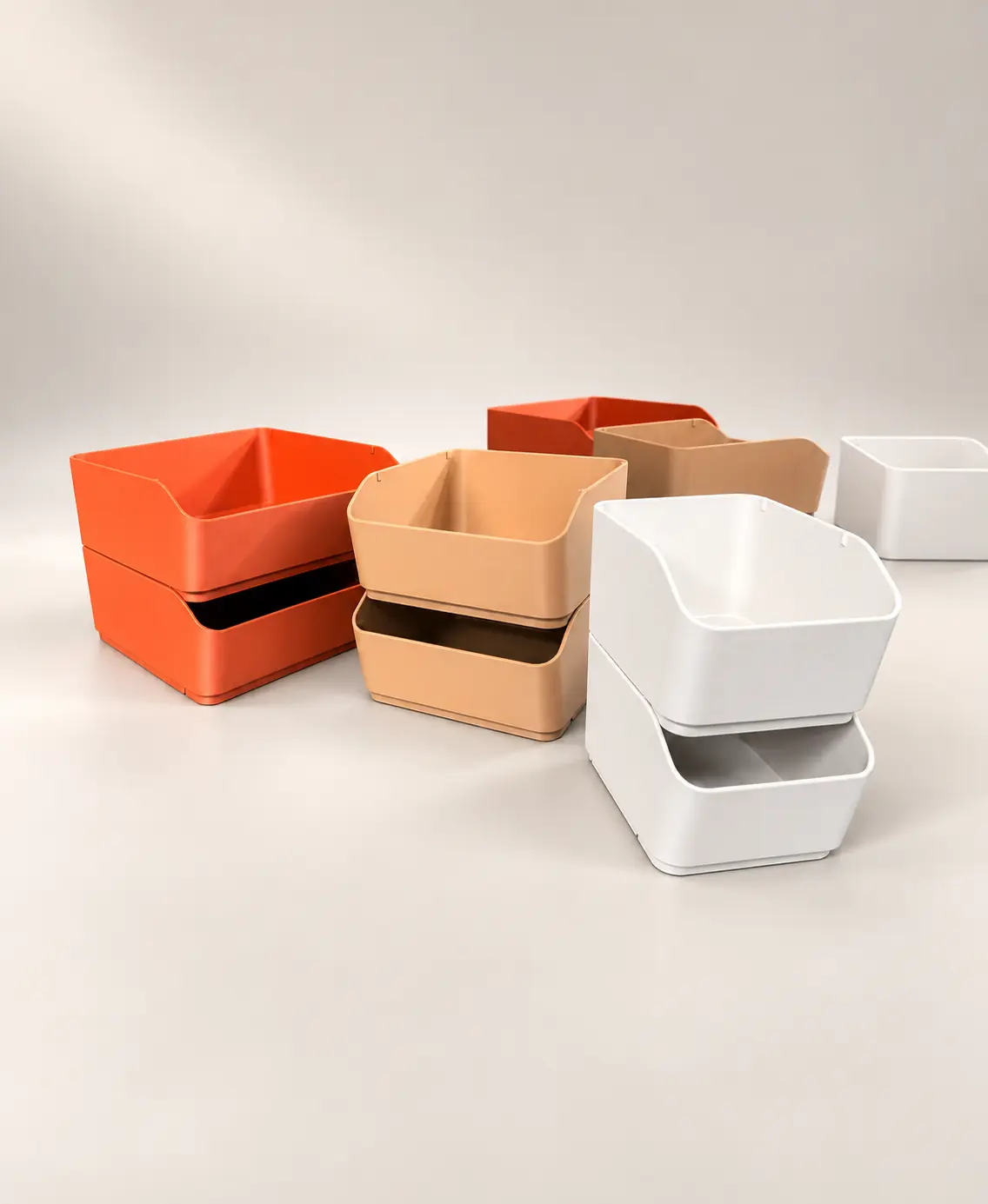 Stackable FORMAstudios storage boxes in warm colors